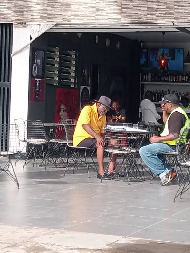 J-Wanz and Mr Adjololo on set rehearsing the script